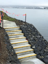 steps down rocky slope to the ocean